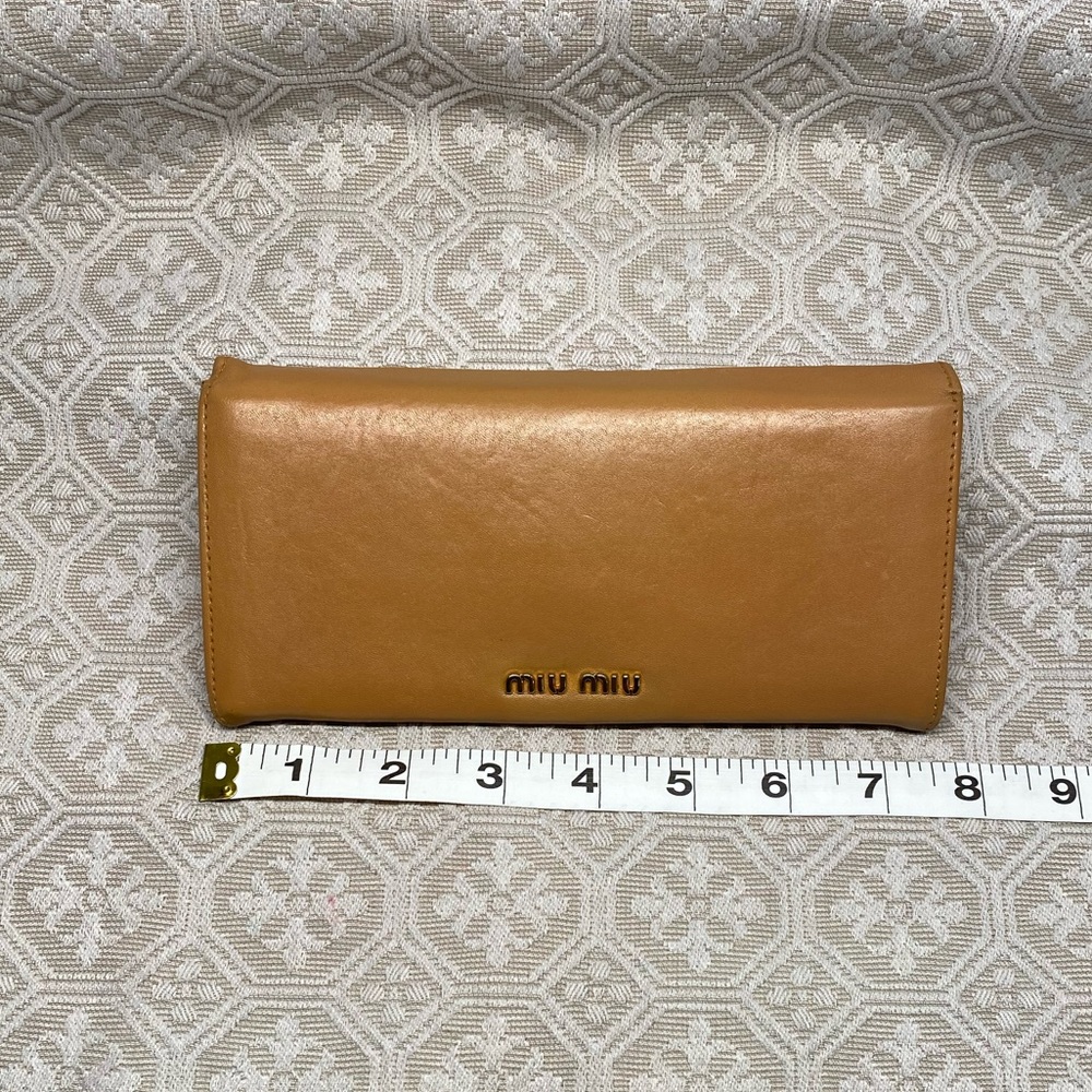 Miu Miu womens folding wallet with clasp